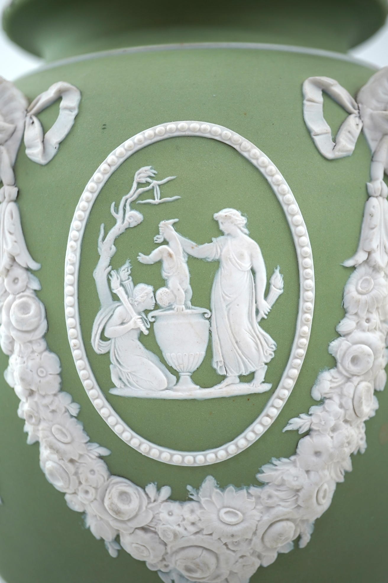 A Wedgwood green jasperware covered pot pourri urn, early 19th century